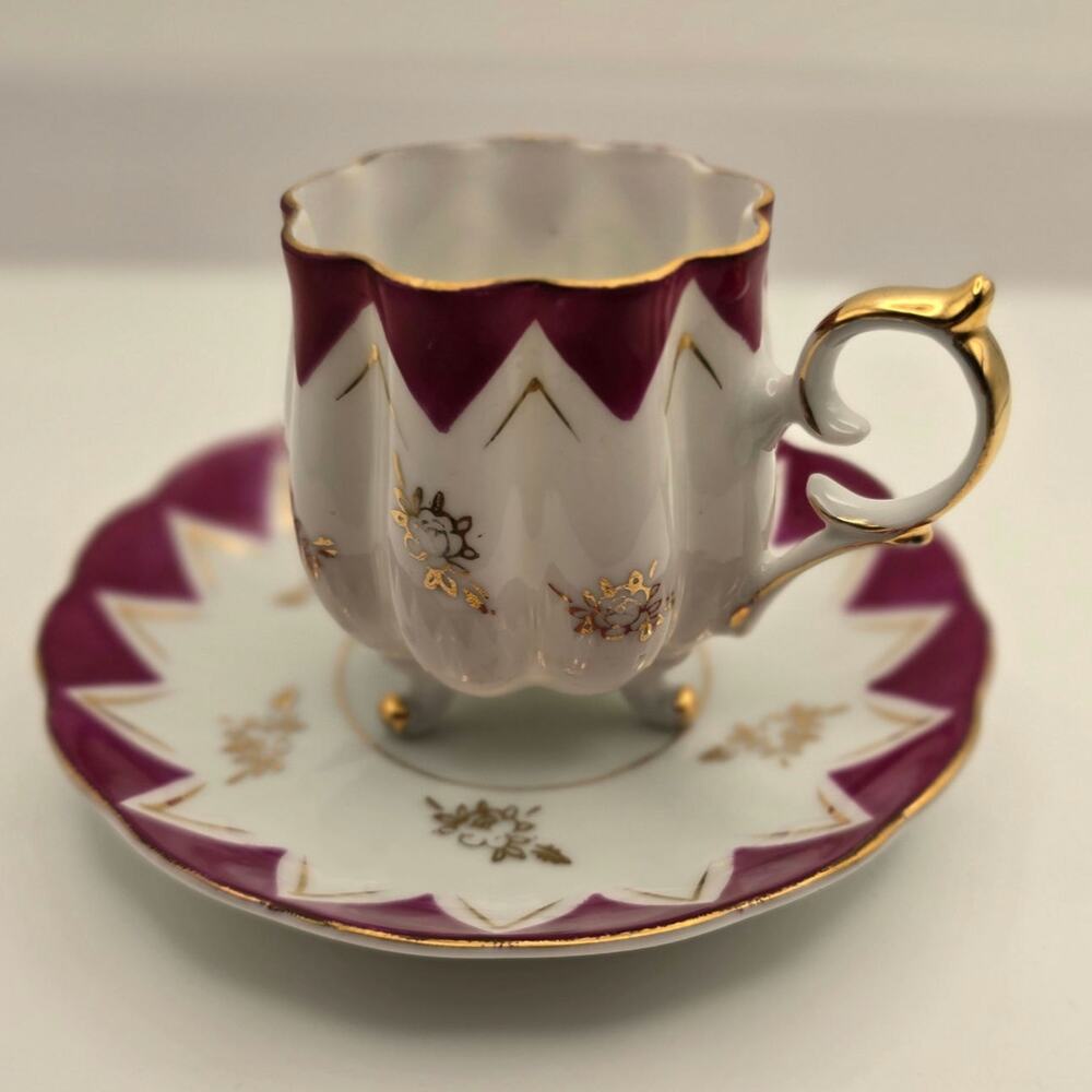 Vintage Porcelain Handpainted cup ans saucer with gold accents